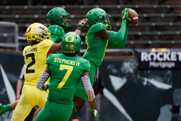 Dontae Manning intercepts a wide receiver reverse pass from Mycah Pittman in Oregon's 2021 spring football game.